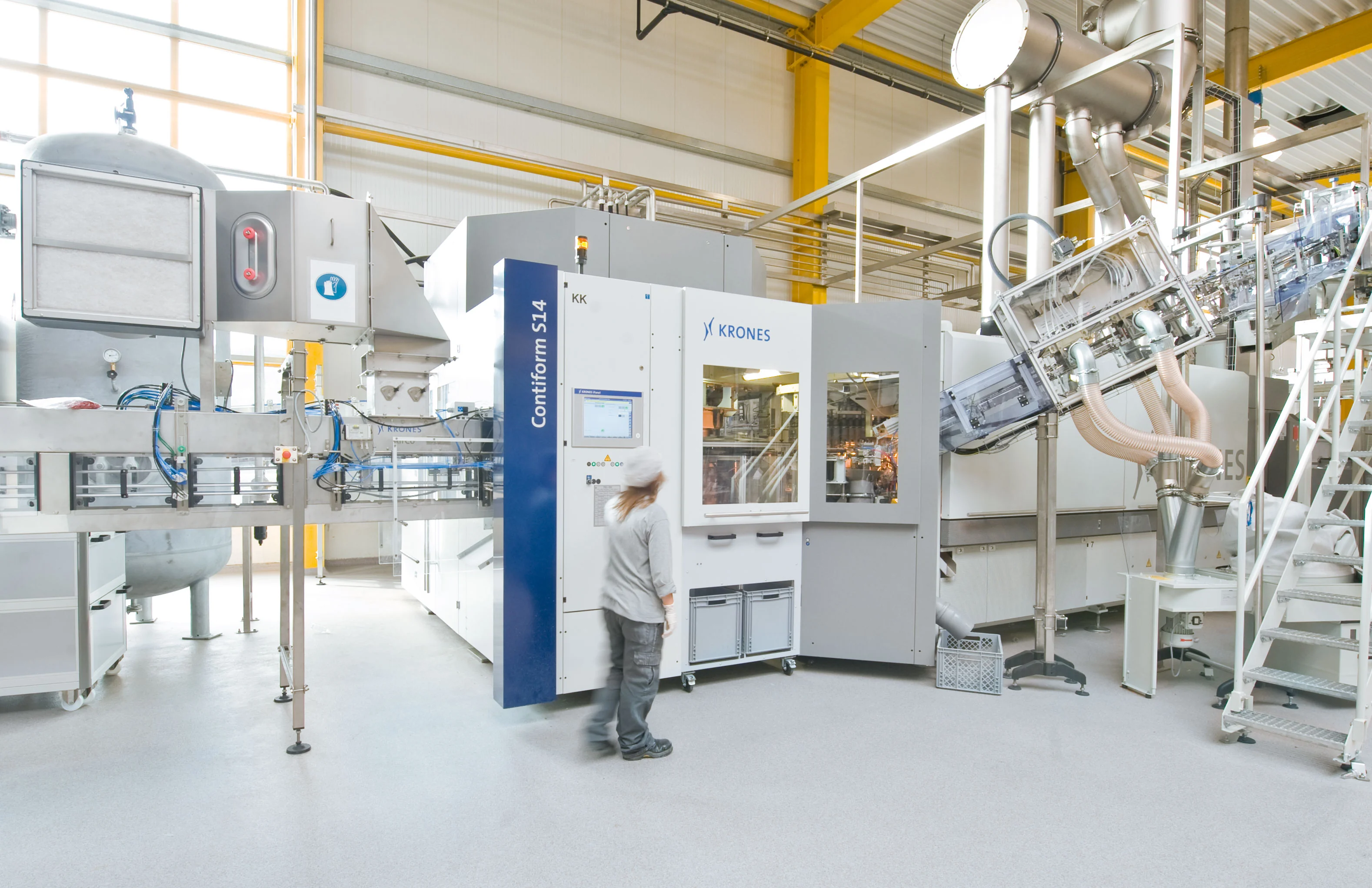 Krones Contiform S14 PET stretch blow-molding machine in a production setting, shown as a representative process scene rather than supplied equipment.